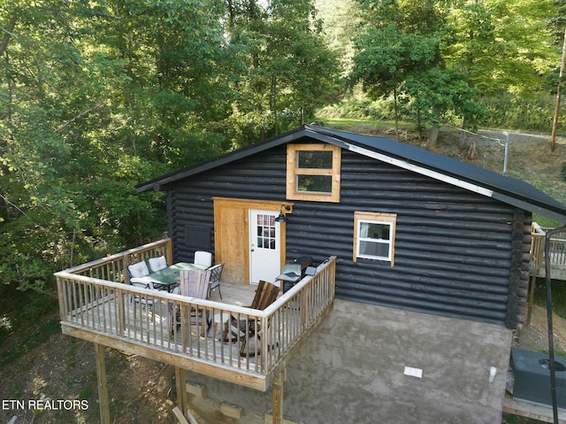 1065 Shell Mountain Rd, Sevierville, TN 37876 - back of house with log exterior, a wooden deck, and outdoor dining area