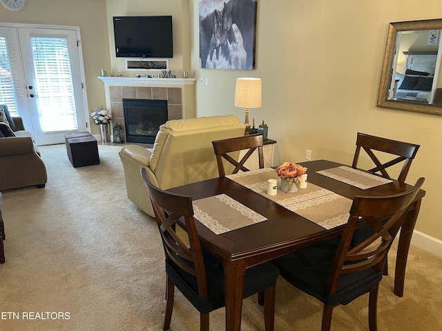 527 River Place Way Unit 516, Sevierville, TN 37862 - carpeted dining area with a tiled fireplace and baseboards