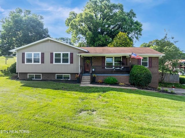 4313 Midview Ln, Knoxville, TN 37938 - tri-level home featuring covered porch, a front yard, and brick siding