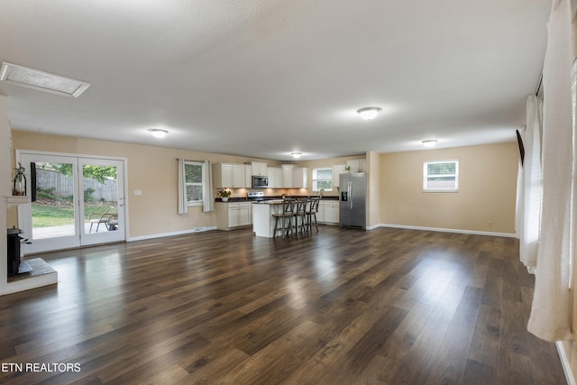 4313 Midview Ln, Knoxville, TN 37938 - unfurnished living room featuring dark wood finished floors and a wood stove