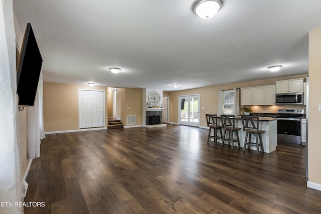 4313 Midview Ln, Knoxville, TN 37938 - unfurnished living room with dark wood finished floors and a fireplace