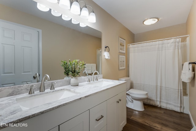 4313 Midview Ln, Knoxville, TN 37938 - full bathroom featuring double vanity, wood finished floors, and shower / tub combo with curtain