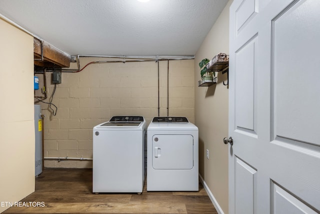 4313 Midview Ln, Knoxville, TN 37938 - laundry room with separate washer and dryer, wood finished floors, gas water heater, and concrete block wall