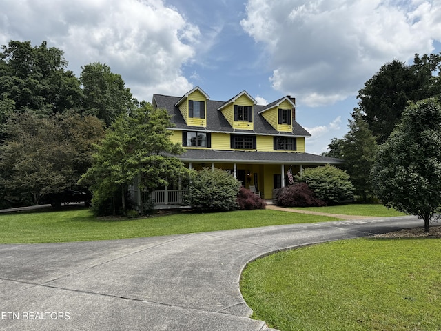 281 Red Williams Rd, Crossville, TN 38555 - farmhouse inspired home featuring a front yard, a porch, driveway, and roof with shingles