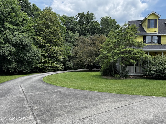 281 Red Williams Rd, Crossville, TN 38555 - view of front of property with curved driveway, a front lawn, and roof with shingles