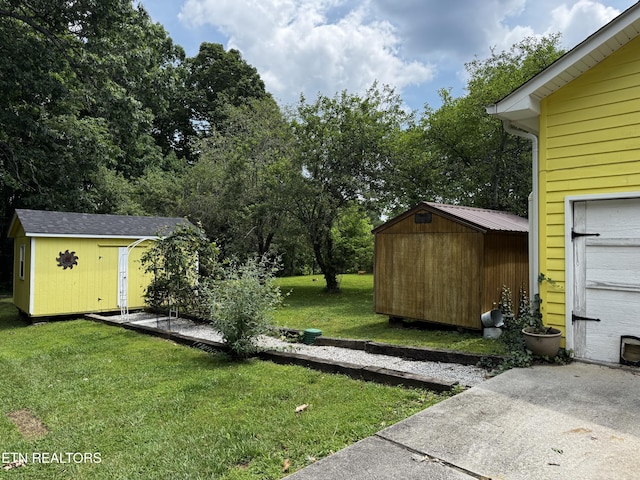 281 Red Williams Rd, Crossville, TN 38555 - view of green lawn with a storage unit and view of scattered trees
