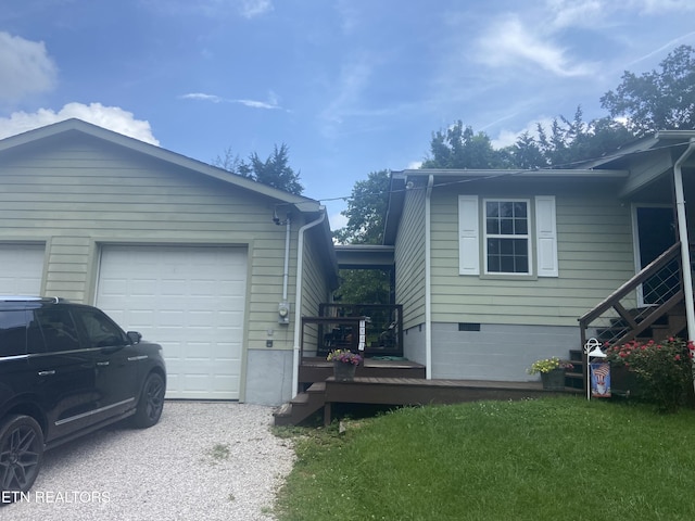 1843 Tazewell Pike, Corryton, TN 37721 - view of side of property featuring gravel driveway, an attached garage, and a lawn