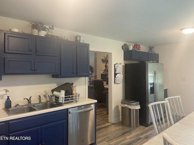 1843 Tazewell Pike, Corryton, TN 37721 - kitchen featuring appliances with stainless steel finishes, blue cabinetry, dark wood-style floors, and light countertops
