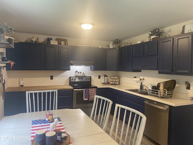1843 Tazewell Pike, Corryton, TN 37721 - kitchen with stainless steel appliances, under cabinet range hood, and light countertops