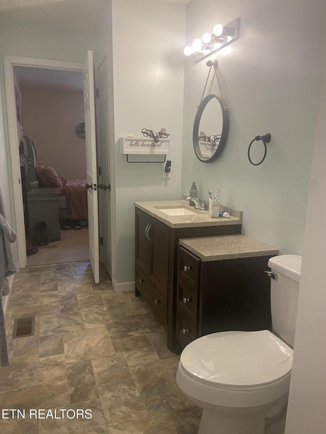 1843 Tazewell Pike, Corryton, TN 37721 - bathroom featuring vanity, stone finish flooring, and ensuite bathroom
