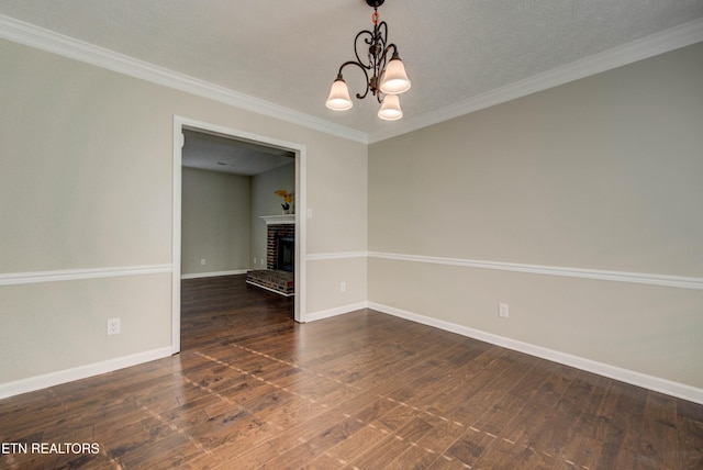 4004 Abercorn Rd, Knoxville, TN 37921 - unfurnished room featuring a chandelier, dark wood-style floors, a fireplace, and crown molding