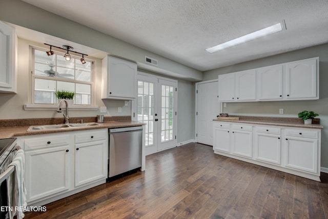 4004 Abercorn Rd, Knoxville, TN 37921 - kitchen featuring appliances with stainless steel finishes, white cabinets, dark wood-style floors, and a textured ceiling