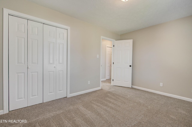4004 Abercorn Rd, Knoxville, TN 37921 - unfurnished bedroom featuring carpet, a closet, and a textured ceiling