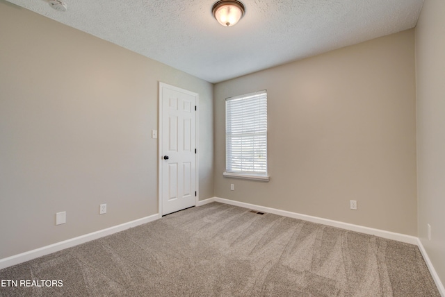 4004 Abercorn Rd, Knoxville, TN 37921 - carpeted empty room with a textured ceiling and a smoke detector