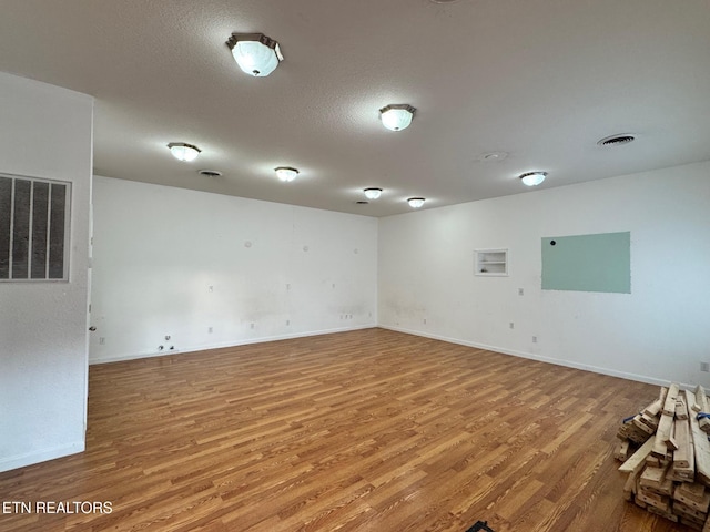 5521 S York Hwy, Grimsley, TN 38565 - unfurnished room with wood finished floors and a textured ceiling
