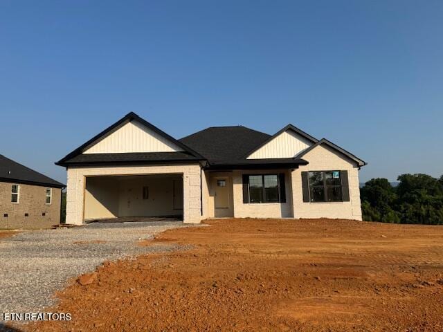1046 Pathways Dr, Seymour, TN 37865 - view of front of property featuring an attached garage and gravel driveway