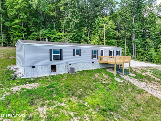 750 Bethlehem Rd, Lafollette, TN 37766 - manufactured / mobile home with a deck, a view of trees, a front lawn, and crawl space