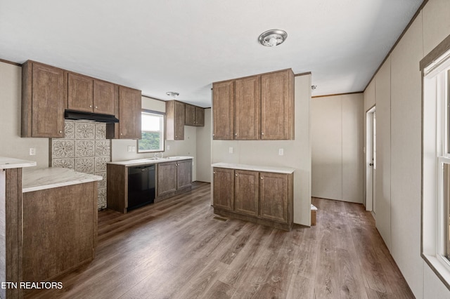 750 Bethlehem Rd, Lafollette, TN 37766 - kitchen with dishwasher, wood finished floors, light countertops, and brown cabinets