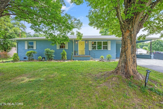 3408 Hackberry Rd, Knoxville, TN 37931 - ranch-style house featuring a front yard, driveway, a carport, and brick siding