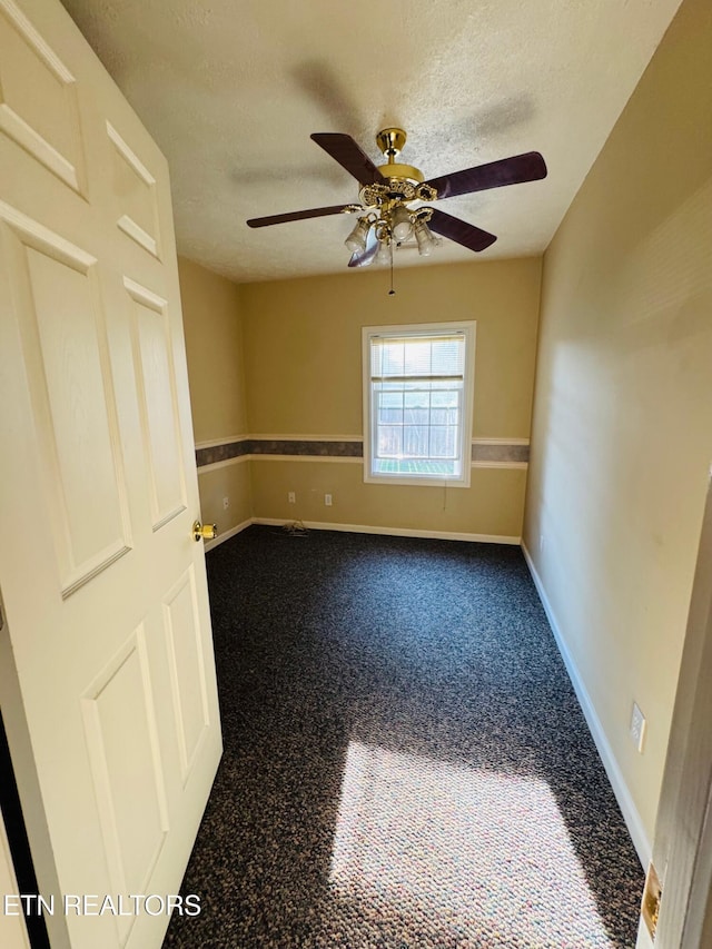 160 Clevenger Cut Off Rd, Newport, TN 37821 - spare room with a ceiling fan, a textured ceiling, and dark carpet