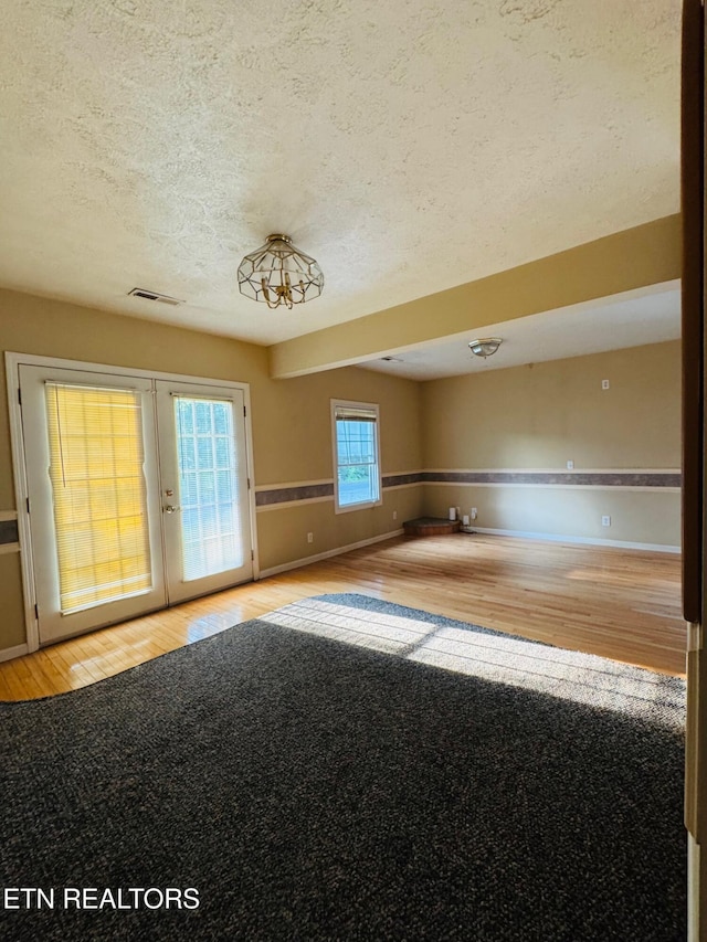 160 Clevenger Cut Off Rd, Newport, TN 37821 - empty room featuring wood finished floors, a textured ceiling, and french doors