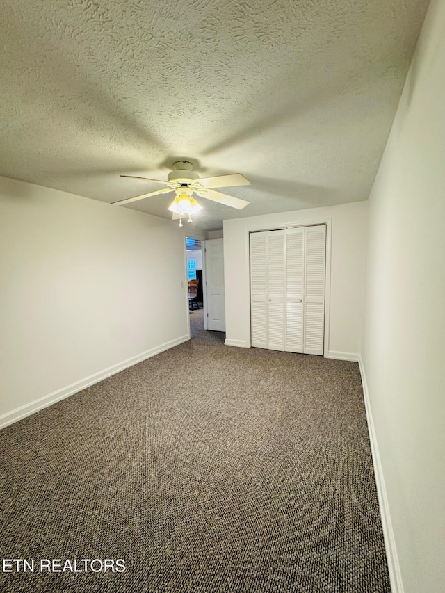 160 Clevenger Cut Off Rd, Newport, TN 37821 - unfurnished bedroom featuring a closet, dark colored carpet, ceiling fan, and a textured ceiling