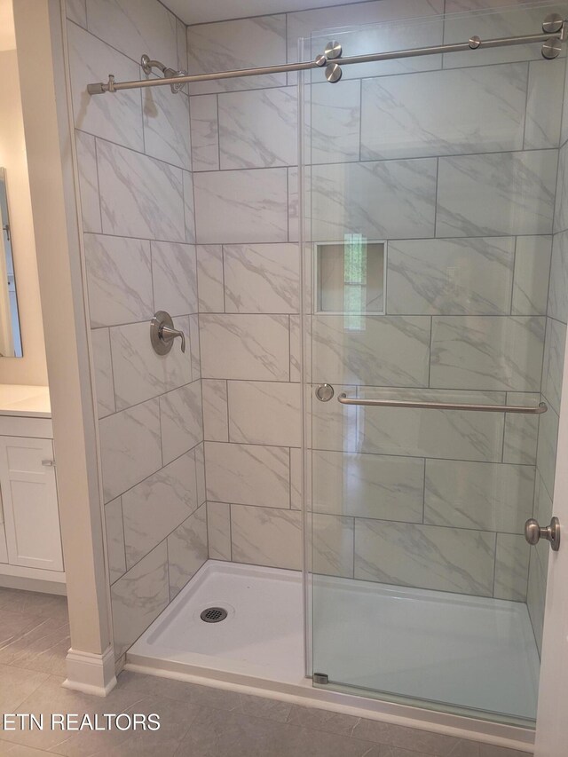 840 Granby Rd, Kingsport, TN 37660 - full bathroom with a stall shower, vanity, and tile patterned flooring