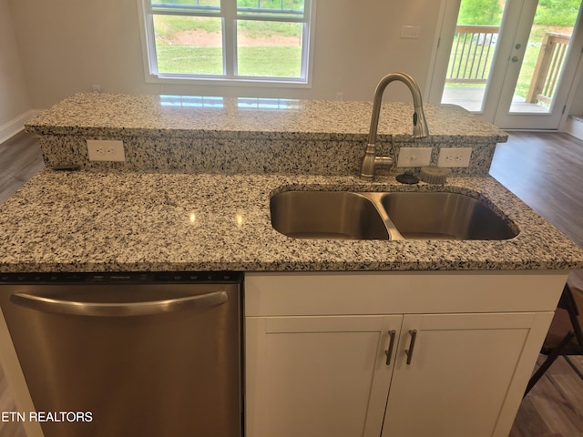 840 Granby Rd, Kingsport, TN 37660 - kitchen with stainless steel dishwasher, light stone countertops, white cabinets, and dark wood-style flooring