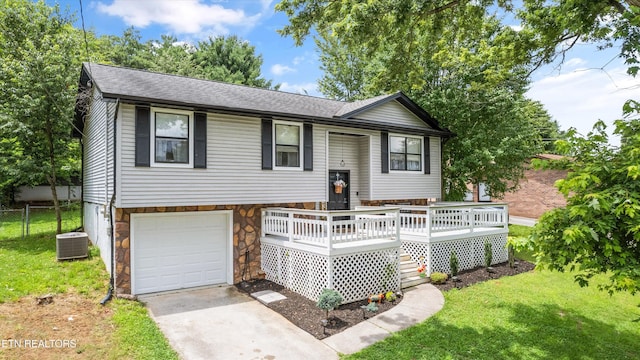 3123 Valemont Dr, Maryville, TN 37803 - split foyer home featuring stone siding, a garage, concrete driveway, a wooden deck, and roof with shingles