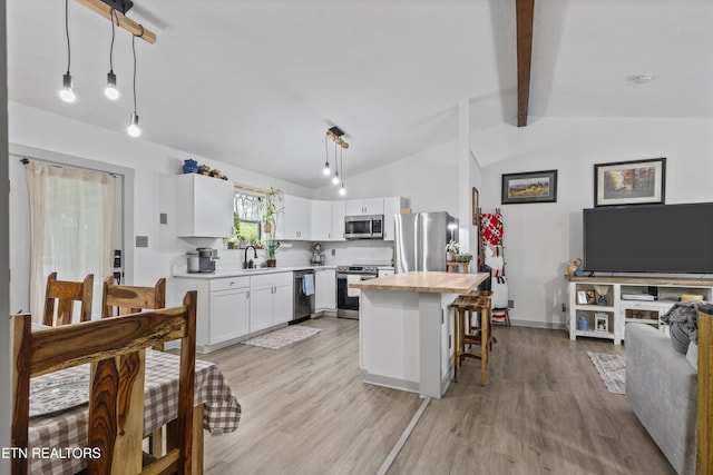 3123 Valemont Dr, Maryville, TN 37803 - kitchen with appliances with stainless steel finishes, butcher block countertops, white cabinetry, a breakfast bar area, and light wood-type flooring