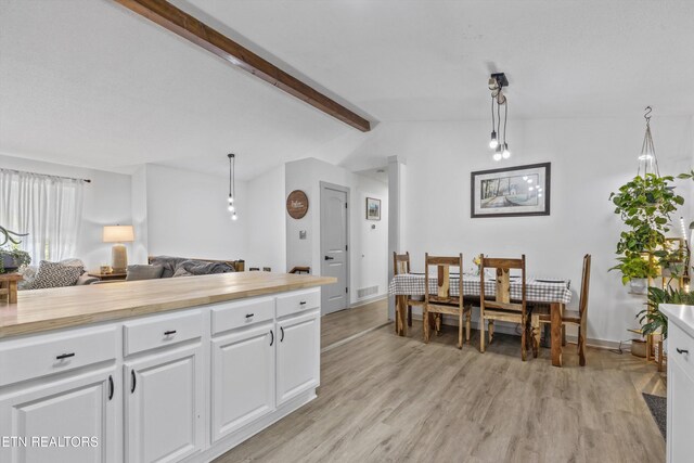 3123 Valemont Dr, Maryville, TN 37803 - kitchen with light wood-style floors, white cabinetry, decorative light fixtures, and butcher block counters