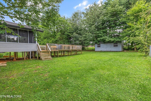 3123 Valemont Dr, Maryville, TN 37803 - view of green lawn featuring a sunroom, a wooden deck, a shed, and stairway