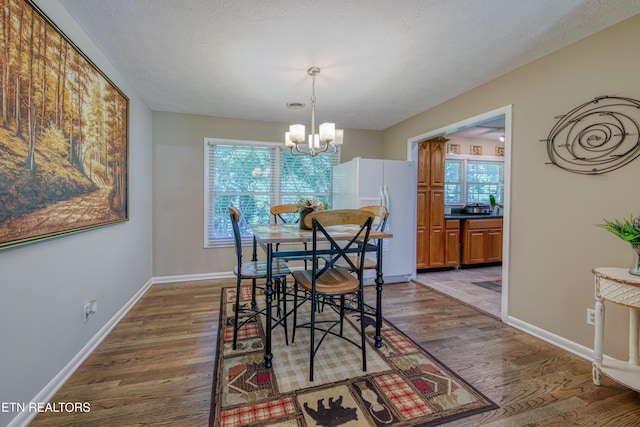 109 Wedgewood Rd, Oak Ridge, TN 37830 - dining area with a chandelier, plenty of natural light, and dark wood-style flooring