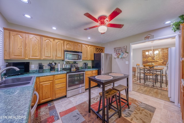 109 Wedgewood Rd, Oak Ridge, TN 37830 - kitchen with stainless steel appliances, recessed lighting, ceiling fan, and a chandelier