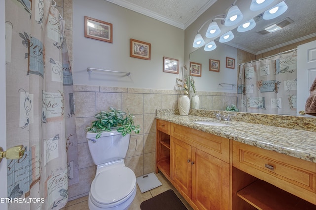 109 Wedgewood Rd, Oak Ridge, TN 37830 - bathroom with tile walls, vanity, a textured ceiling, tile patterned flooring, and ornamental molding