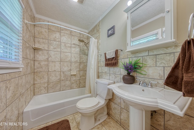 109 Wedgewood Rd, Oak Ridge, TN 37830 - full bath featuring ornamental molding, a textured ceiling, shower / tub combo, tile walls, and tile patterned floors