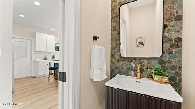 130 S Van Gilder St, Knoxville, TN 37915 - bathroom featuring decorative backsplash, wood finished floors, vanity, and recessed lighting