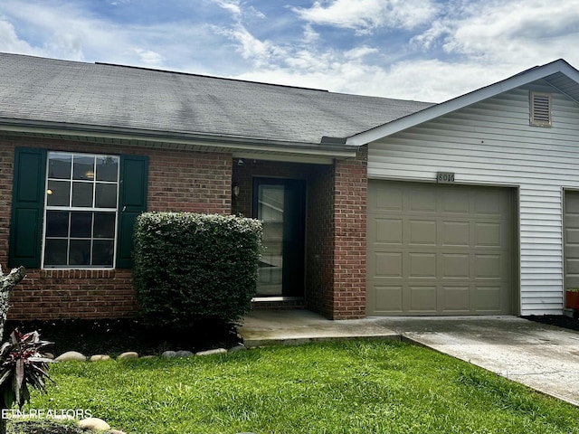 8016 Stablegate Way, Powell, TN 37849 - ranch-style home with concrete driveway, a garage, and brick siding