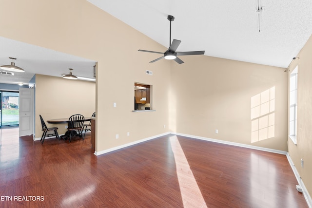 8016 Stablegate Way, Powell, TN 37849 - unfurnished living room with ceiling fan, wood finished floors, and high vaulted ceiling