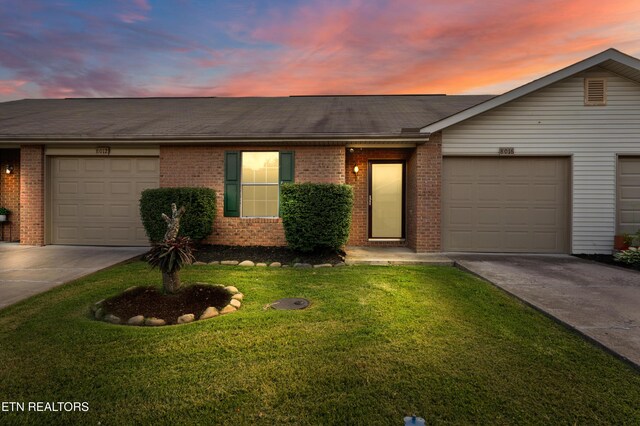 8016 Stablegate Way, Powell, TN 37849 - ranch-style home with driveway, brick siding, a front yard, and an attached garage