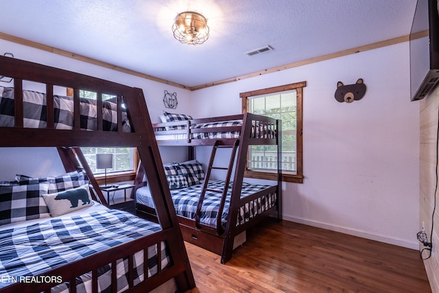 460 Red Bud Ln, Sevierville, TN 37876 - bedroom with wood finished floors and a textured ceiling