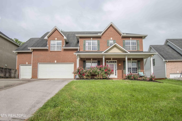 1223 Walnut Branch Ln, Knoxville, TN 37922 - traditional-style house featuring brick siding, a front yard, and concrete driveway