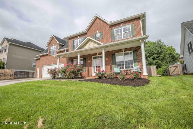 1223 Walnut Branch Ln, Knoxville, TN 37922 - view of front of house with brick siding, covered porch, driveway, and a garage
