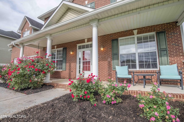1223 Walnut Branch Ln, Knoxville, TN 37922 - view of exterior entry with covered porch and brick siding