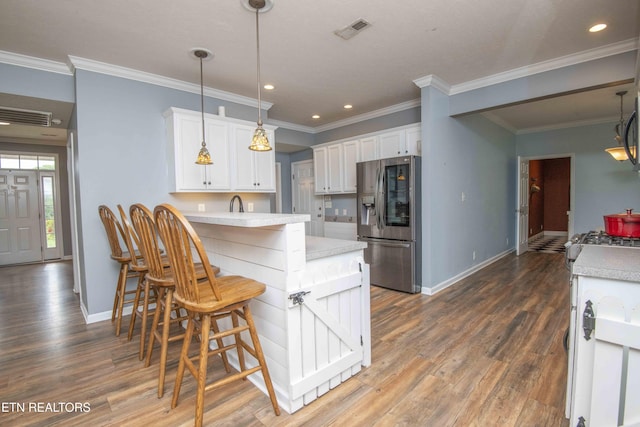 1223 Walnut Branch Ln, Knoxville, TN 37922 - kitchen with stainless steel fridge, a peninsula, light countertops, white cabinetry, and recessed lighting