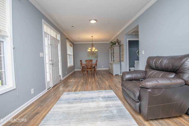 1223 Walnut Branch Ln, Knoxville, TN 37922 - living room featuring a chandelier, ornamental molding, and wood finished floors