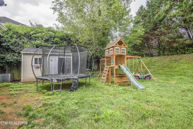1223 Walnut Branch Ln, Knoxville, TN 37922 - view of green lawn with a trampoline, a shed, and a playground