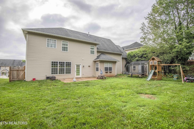 1223 Walnut Branch Ln, Knoxville, TN 37922 - back of house featuring a playground, a patio, and a trampoline