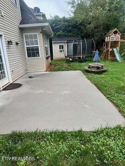 1223 Walnut Branch Ln, Knoxville, TN 37922 - view of patio with a trampoline and a playground