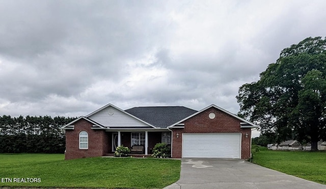 910 Mossy Grove Ln, Maryville, TN 37801 - view of front of house featuring covered porch, an attached garage, brick siding, and a front yard